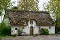 Traditional Danish house with thatched reed roof in a coastal sand dune landscape Royalty Free Stock Photo