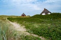 Traditional danish houses with thatched roof on shores of Blavand beaches Royalty Free Stock Photo