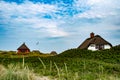 Traditional danish houses with thatched roof on shores of Blavand beaches Royalty Free Stock Photo