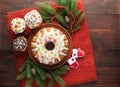 Traditional decorated christmas cake at wooden table