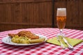 Traditional deep fried chicken schnitzel served with mashed potatoes and pickled cucumbers with lager beer in the glass. Royalty Free Stock Photo