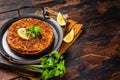 Traditional delicious Turkish foods lahmacun with mince lamb meat in steel tray. Wooden background. Top view. Copy space Royalty Free Stock Photo