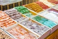 Traditional delights sweet rolls, oriental sweets lukum, lokum, nougat arranged in boxes on the counter of the store Royalty Free Stock Photo