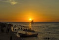 A traditional dhow in the background of a golden sunset, Stone T Royalty Free Stock Photo