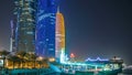 Traditional dhow boat in Doha at night timelapse, with modern buildings in the background. Royalty Free Stock Photo