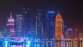 Traditional dhow boat in Doha at night timelapse, with modern buildings in the Royalty Free Stock Photo