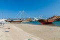 Traditional dhow boat yards in Sur, Oman. Khor al Batar bridge in the backgroun Royalty Free Stock Photo