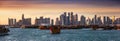 The traditional Dhow harbor in front of the modern skyline of Doha, Qatar