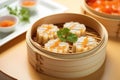 traditional dim sum bamboo steamer, filled with carrots Royalty Free Stock Photo