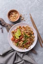 Traditional dish of asian cuisine is pad thai. Udon noodles with shrimps and fried tofu Royalty Free Stock Photo