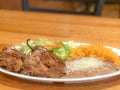 A traditional dish of Carnitas Rice and Beans