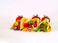 Traditional dish of Mexican cuisine. Corn tortilla tacos with vegetable filling on isolated white background.