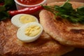 Malawach with hard boiled eggs and tomatoes. Malawach or malawah: traditional fried bread of Yemenite Jews