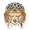 traditional distressed sticker tattoo of female face with third eye crying