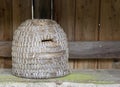 A traditional domed shaped woven bee hive