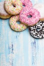 Traditional donuts on white wooden background.