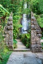 Traditional double stone gate on waterfall Royalty Free Stock Photo