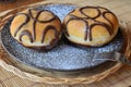 Traditional doughnut with chocolate on the brown plate