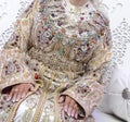 The traditional dress of the Moroccan bride. Beautiful bride wearing Moroccan caftan and precious jewelry Royalty Free Stock Photo