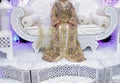 The traditional dress of the Moroccan bride. Beautiful bride wearing Moroccan caftan and precious jewelry