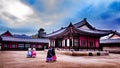 Traditional dressed korean girls walking in the palace