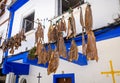 Traditional dried fish in front of a Cudillero house, Asturias, Spain Royalty Free Stock Photo