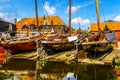 Traditional Dutch Botter Fishing Boats on the Dry Dock in the Harbor of the historic village of Spakenburg-Bunschoten Royalty Free Stock Photo