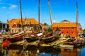 Traditional Dutch Botter Fishing Boats on the Dry Dock in the Harbor of the historic village of Spakenburg-Bunschoten Royalty Free Stock Photo