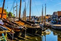 Traditional Dutch Botter Fishing Boats on the Dry Dock in the Harbor of the historic village of Spakenburg-Bunschoten Royalty Free Stock Photo