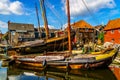 Traditional Dutch Botter Fishing Boats on the Dry Dock in the Harbor of the historic village of Spakenburg-Bunschoten Royalty Free Stock Photo