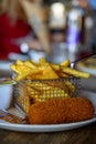 Traditional Dutch fast food snacks, fricandel and french fried potato chips