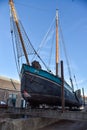 Traditional Dutch flat-bottomed boat on the ramp of the former `Willemsoord` shipyard in Den Helder