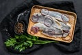 Traditional Dutch food herring with red onion. New season of herring called Hollandse nieuwe. Black background. Top view