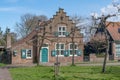 Traditional Dutch house with stepped gable and coloured shutters Royalty Free Stock Photo