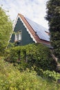 Traditional dutch house with wooden front and solar panels Royalty Free Stock Photo