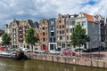 Traditional dutch houses lining street on canal