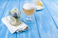 Traditional Dutch marinated herring with lemon and onions in a jar. Fresh Belgian beer in a glass. Seafood on a blue background. Royalty Free Stock Photo