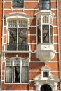 Traditional dutch old facades located on Weesperzijde Street along Amstel river, Amsterdam Royalty Free Stock Photo