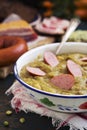 Traditional Dutch pea soup and ingredients on a rustic table Royalty Free Stock Photo