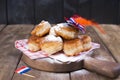 Traditional Dutch sweet pastries. Feast day of the King. Decor. Orange things for the holiday. Netherlands. Donuts and utensils