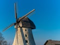 Traditional dutch windmill with blue sky on background. Old european style. Royalty Free Stock Photo