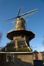 Traditional dutch windmill in the city of Delft Royalty Free Stock Photo