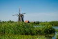 Traditional dutch windmill in famous Kinderdijk, The Netherlands Royalty Free Stock Photo