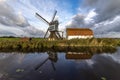 Traditional Dutch windmill with its barn Royalty Free Stock Photo
