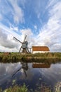 Traditional Dutch windmill with its barn Royalty Free Stock Photo