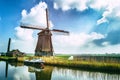 Traditional dutch windmill near the canal Royalty Free Stock Photo