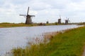 Traditional dutch windmill near the canal. Netherlands Royalty Free Stock Photo