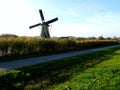 Traditional dutch windmill near the canal. Netherlands Royalty Free Stock Photo