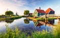 Traditional dutch windmill near the canal. Netherlands, Landcape at sunset Royalty Free Stock Photo