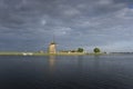 Traditional dutch windmill near the canal. Netherlands. Royalty Free Stock Photo